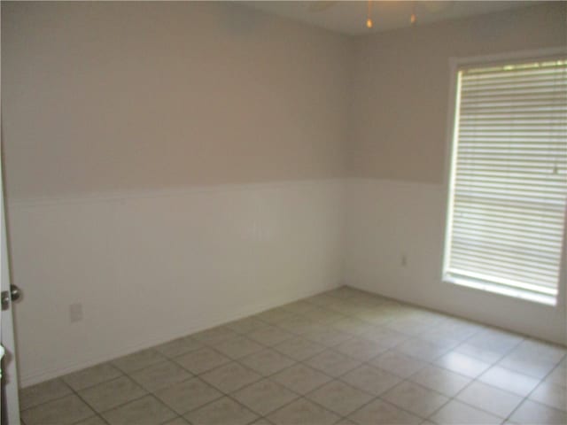 spare room with light tile patterned floors