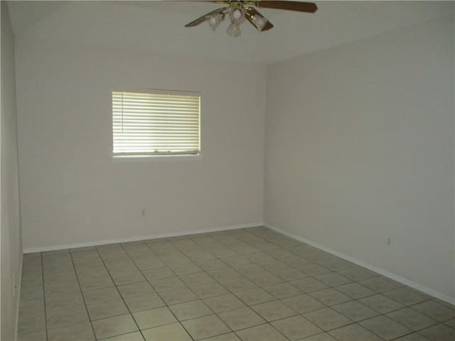 empty room featuring ceiling fan and light tile patterned floors