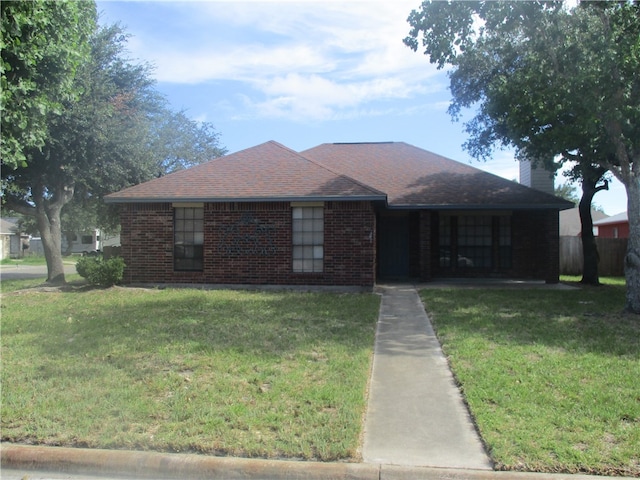 single story home with a front yard