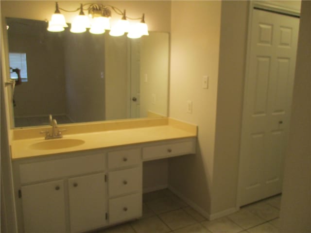 bathroom with tile patterned flooring and vanity