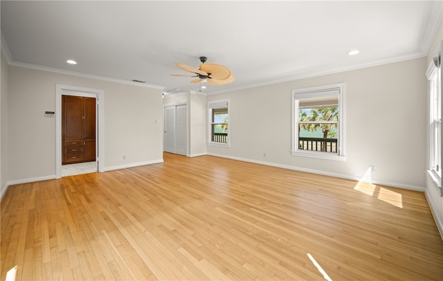 spare room featuring ceiling fan, light hardwood / wood-style flooring, and crown molding