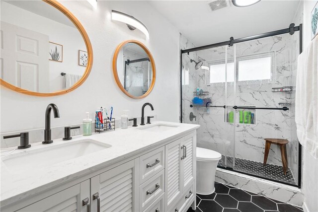 5830 Woodhaven Dr, Corpus Christi, TX 78412 - full bath featuring a marble finish shower, double vanity, and tile patterned flooring