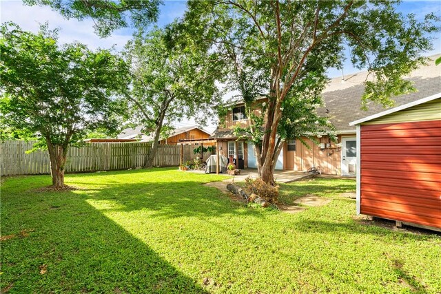 5830 Woodhaven Dr, Corpus Christi, TX 78412 - fenced backyard with a patio
