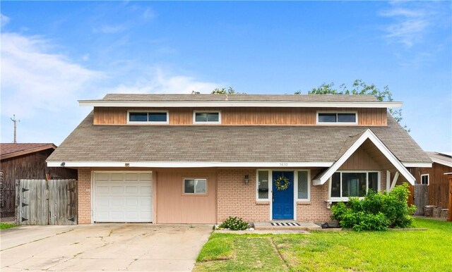 5830 Woodhaven Dr, Corpus Christi, TX 78412 - view of front facade with driveway and a shingled roof