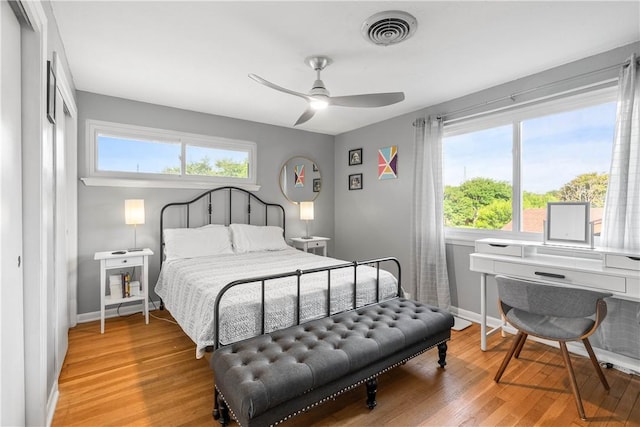 5830 Woodhaven Dr, Corpus Christi, TX 78412 - bedroom featuring light wood finished floors, multiple windows, a ceiling fan, and a closet