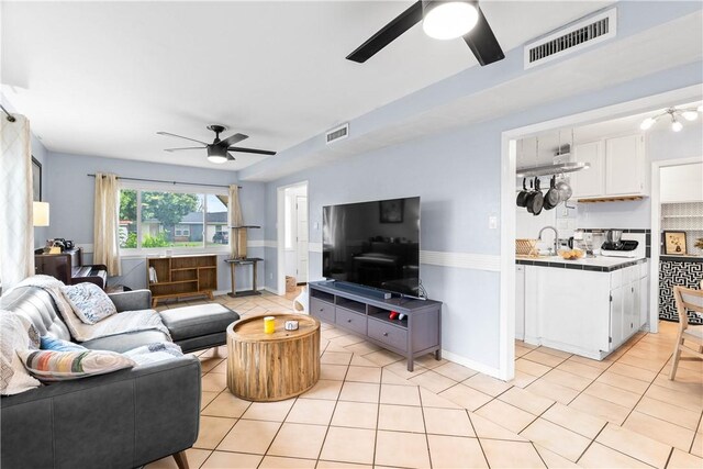 5830 Woodhaven Dr, Corpus Christi, TX 78412 - living area featuring ceiling fan and light tile patterned flooring