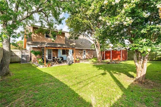 5830 Woodhaven Dr, Corpus Christi, TX 78412 - fenced backyard with a patio area and a storage unit