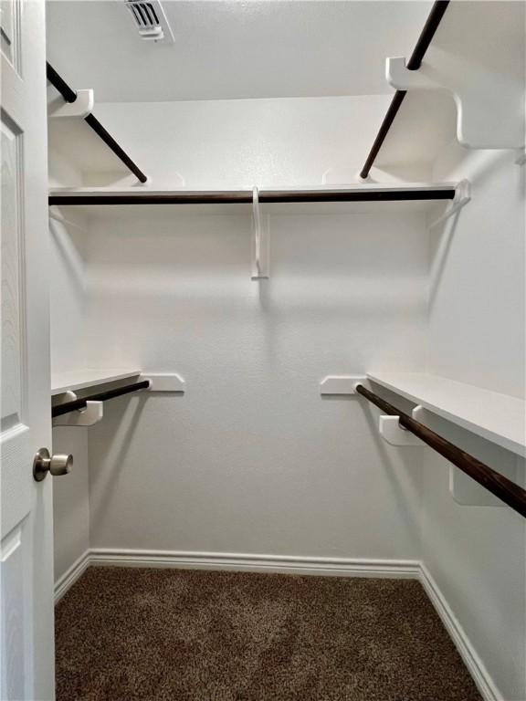 1652 16th St, Corpus Christi, TX 78404 - walk in closet featuring carpet flooring