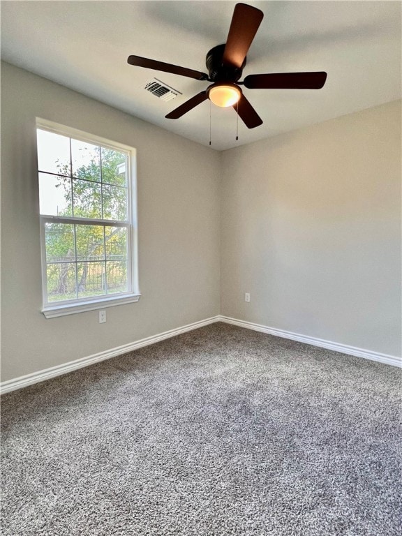 spare room with ceiling fan and carpet floors