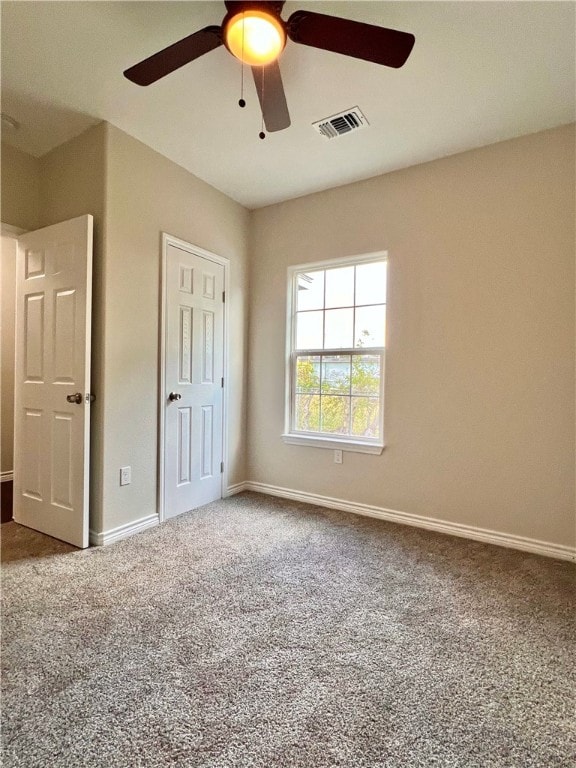 unfurnished bedroom with carpet floors and ceiling fan