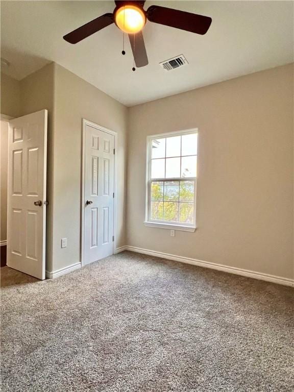 1652 16th St, Corpus Christi, TX 78404 - unfurnished bedroom featuring carpet, baseboards, and ceiling fan