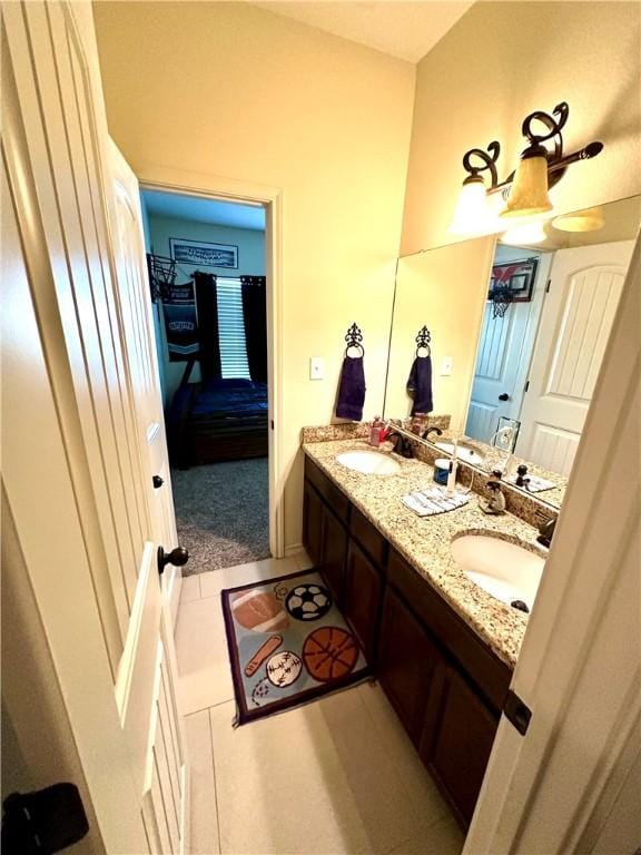 bathroom featuring tile patterned floors and vanity