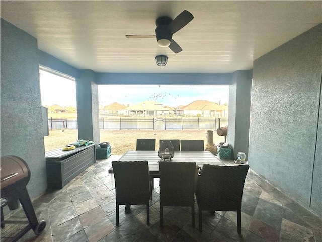 view of patio featuring ceiling fan