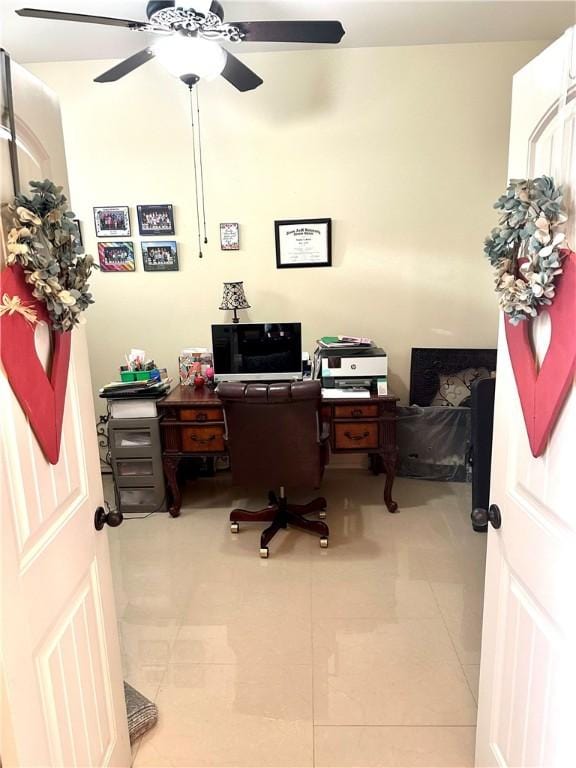 home office featuring ceiling fan and tile patterned flooring