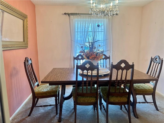 dining area featuring baseboards, carpet floors, and an inviting chandelier