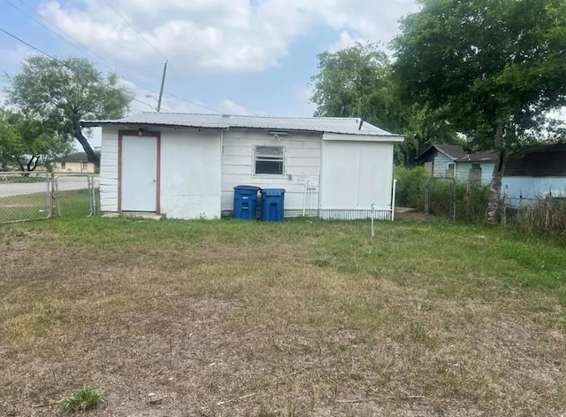 view of outbuilding with a yard