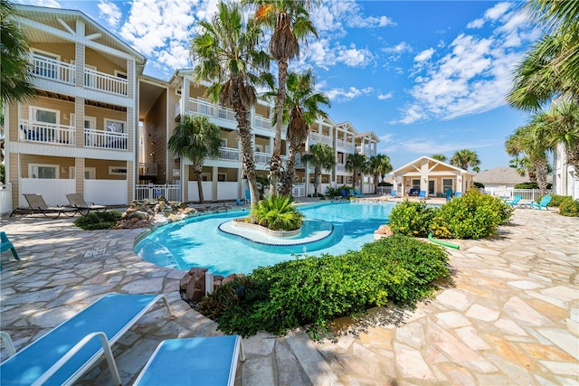 view of swimming pool with a patio