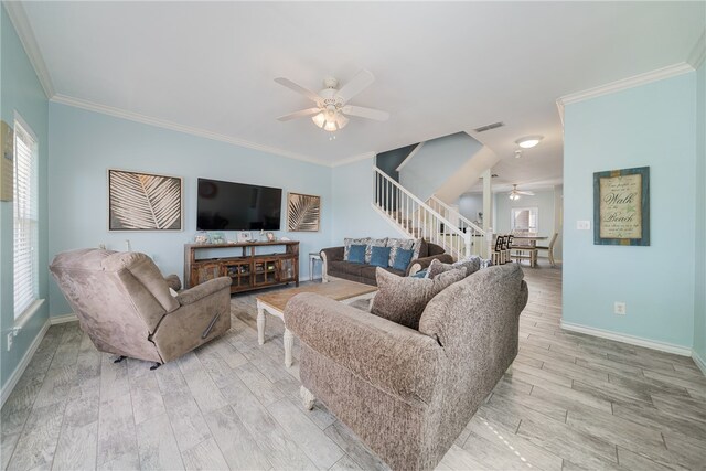 living room with ornamental molding, ceiling fan, and light hardwood / wood-style floors