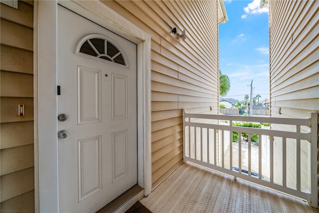 doorway to property featuring a balcony