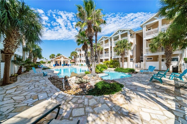 view of pool featuring a patio