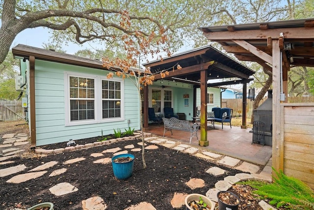 rear view of house with a patio and ceiling fan