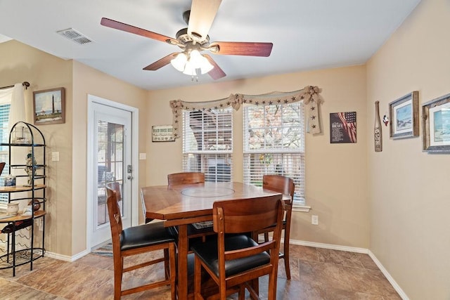 dining space featuring ceiling fan