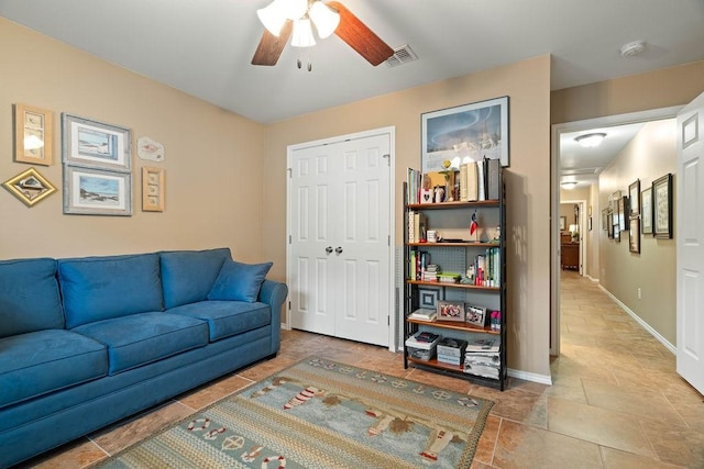 living room featuring ceiling fan