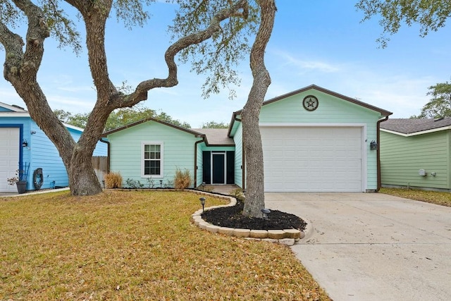 ranch-style home featuring a garage and a front yard