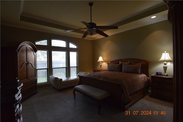 bedroom featuring multiple windows, carpet, ceiling fan, and crown molding