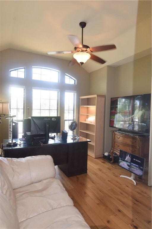 home office featuring light wood-type flooring, lofted ceiling, and ceiling fan