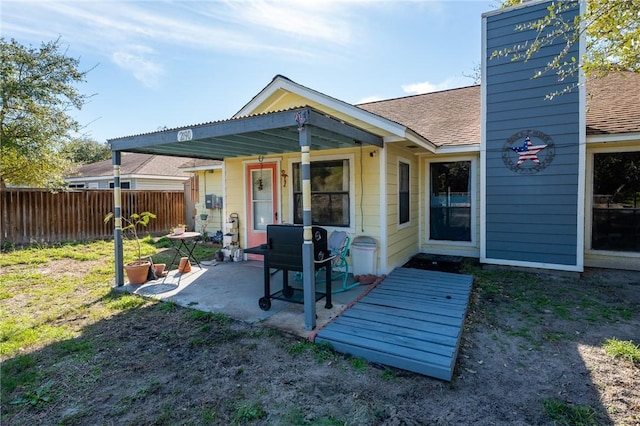 back of house with a patio