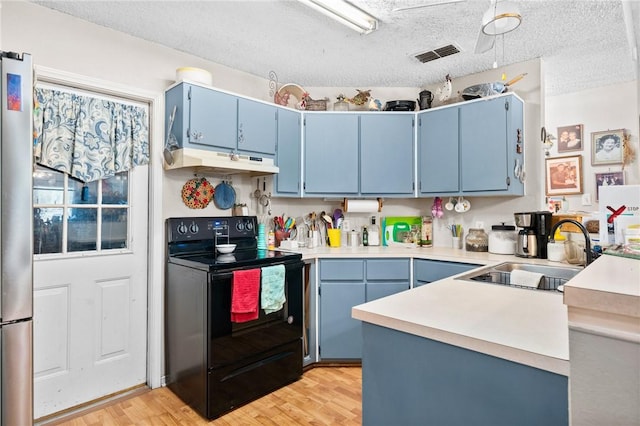 kitchen with light hardwood / wood-style floors, black / electric stove, blue cabinetry, and sink