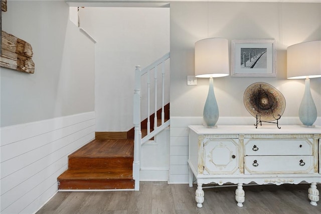 stairs featuring wood-type flooring