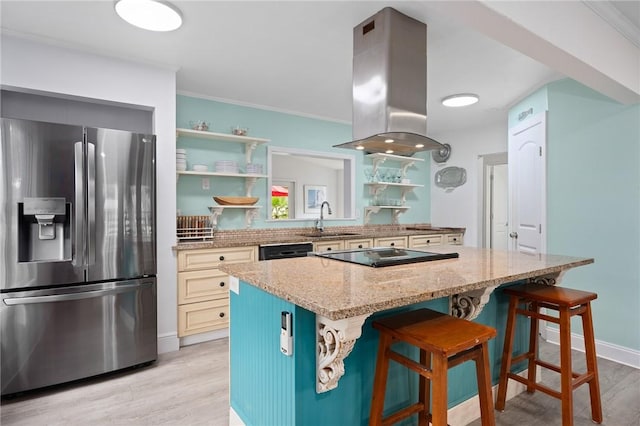 kitchen with sink, stainless steel refrigerator with ice dispenser, a kitchen island, a kitchen bar, and island exhaust hood