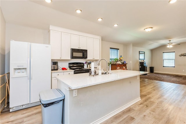 1517 Dorado St, Corpus Christi, TX 78417 - kitchen featuring black appliances, white cabinetry, ceiling fan, light wood-style flooring, and recessed lighting