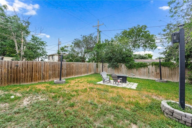 1517 Dorado St, Corpus Christi, TX 78417 - fenced backyard with a fire pit and a patio