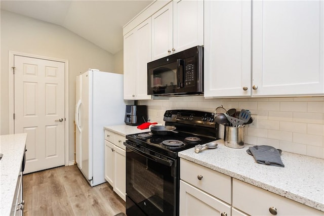 1517 Dorado St, Corpus Christi, TX 78417 - kitchen with black appliances, lofted ceiling, light wood-style floors, white cabinetry, and decorative backsplash