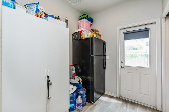 1517 Dorado St, Corpus Christi, TX 78417 - kitchen featuring freestanding refrigerator and wood finished floors