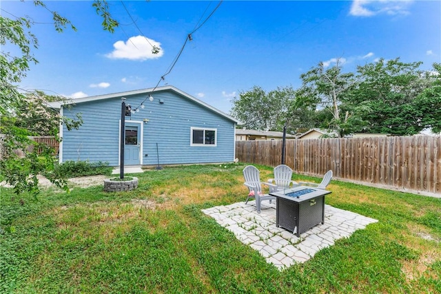 1517 Dorado St, Corpus Christi, TX 78417 - rear view of house with a fire pit, a fenced backyard, and a patio