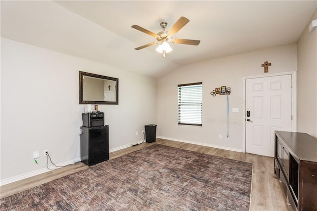 1517 Dorado St, Corpus Christi, TX 78417 - unfurnished living room with wood finished floors, ceiling fan, and vaulted ceiling