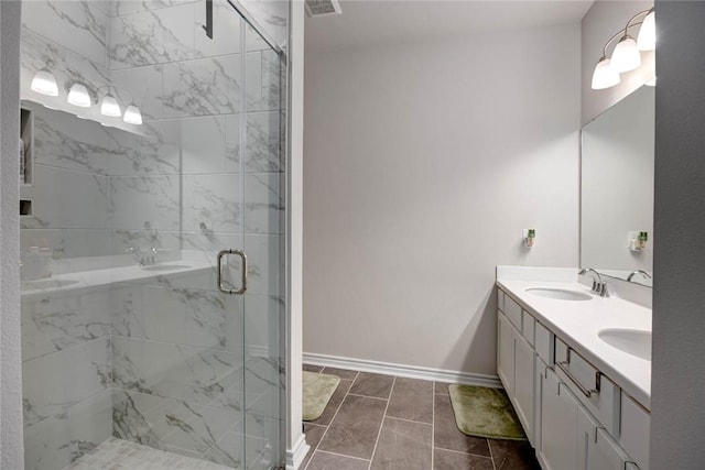 bathroom with vanity, tile patterned flooring, and a shower with door