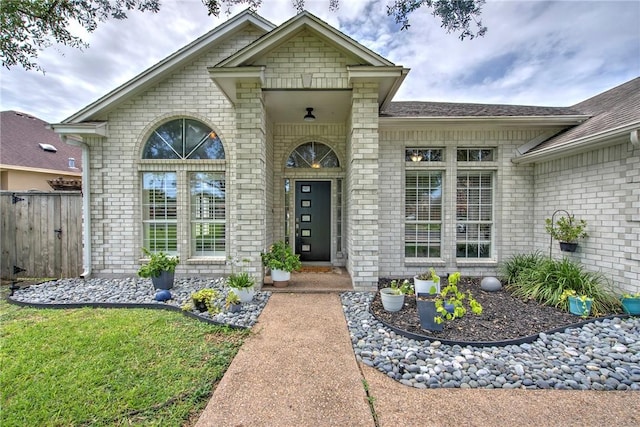 7410 Lake Micala Dr, Corpus Christi, TX 78413 - view of exterior entry with brick siding and roof with shingles