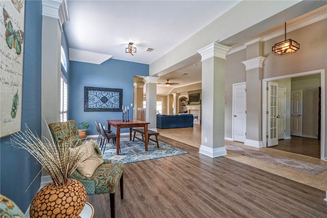 7410 Lake Micala Dr, Corpus Christi, TX 78413 - living room featuring decorative columns, wood finished floors, and a ceiling fan