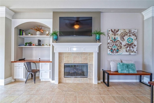 7410 Lake Micala Dr, Corpus Christi, TX 78413 - living area featuring a fireplace, built in desk, and light tile patterned floors