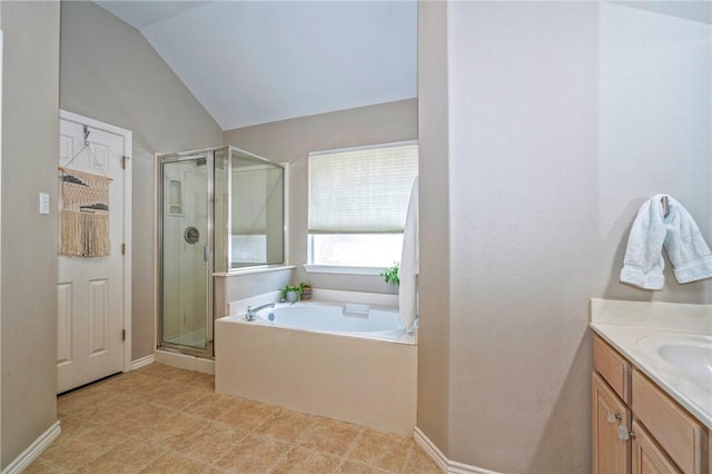 7410 Lake Micala Dr, Corpus Christi, TX 78413 - full bathroom with a stall shower, a garden tub, vaulted ceiling, and vanity