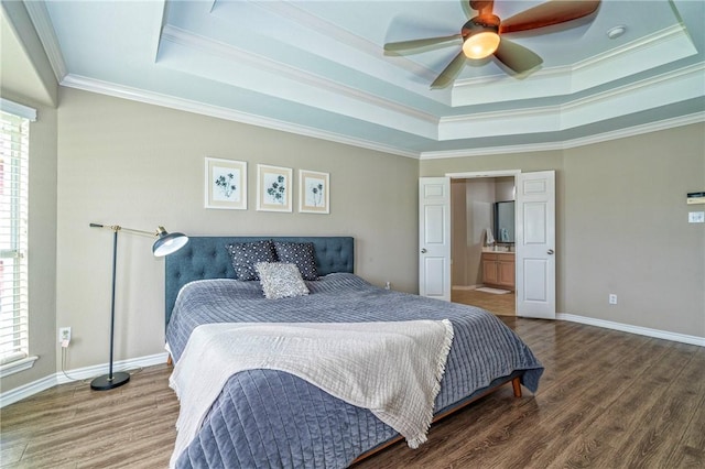 7410 Lake Micala Dr, Corpus Christi, TX 78413 - bedroom featuring a tray ceiling, crown molding, wood finished floors, ensuite bath, and ceiling fan