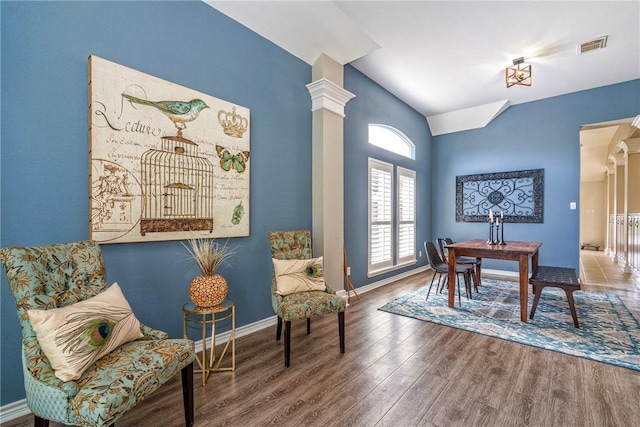 7410 Lake Micala Dr, Corpus Christi, TX 78413 - living area featuring lofted ceiling, wood finished floors, and decorative columns