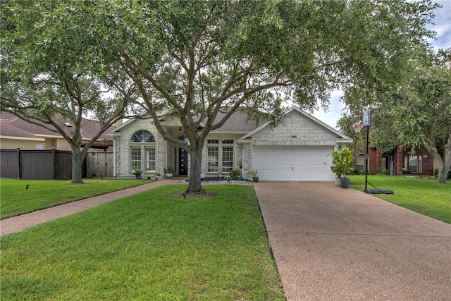 7410 Lake Micala Dr, Corpus Christi, TX 78413 - view of front of property featuring a garage, driveway, and brick siding