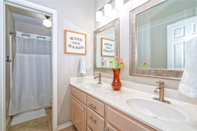 7410 Lake Micala Dr, Corpus Christi, TX 78413 - full bath with double vanity and tile patterned flooring