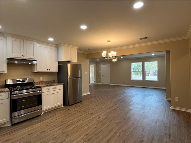 kitchen featuring dark wood-type flooring, stainless steel appliances, a notable chandelier, stone countertops, and white cabinets